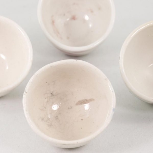 Antique Miniature Tea Cup in White Porcelain Flower Design